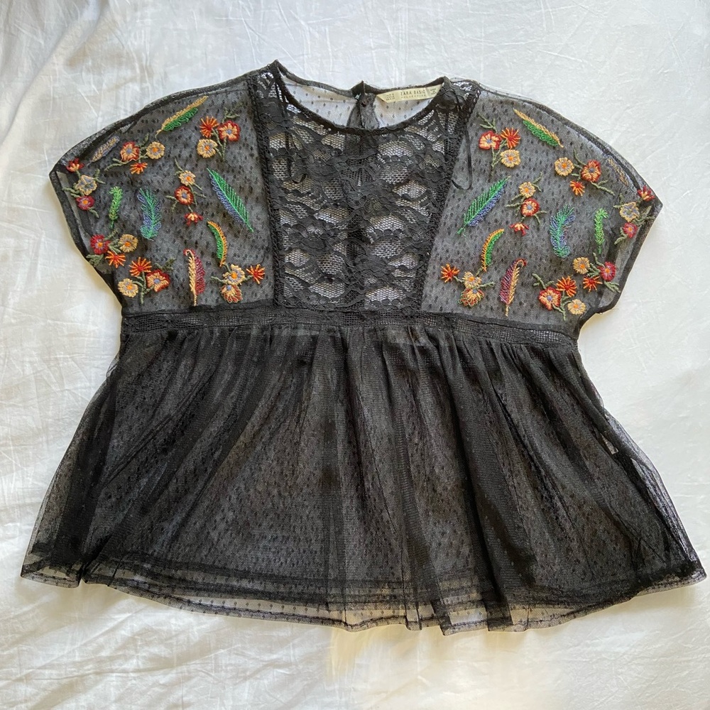 Sheer black blouse with embroidered flowers